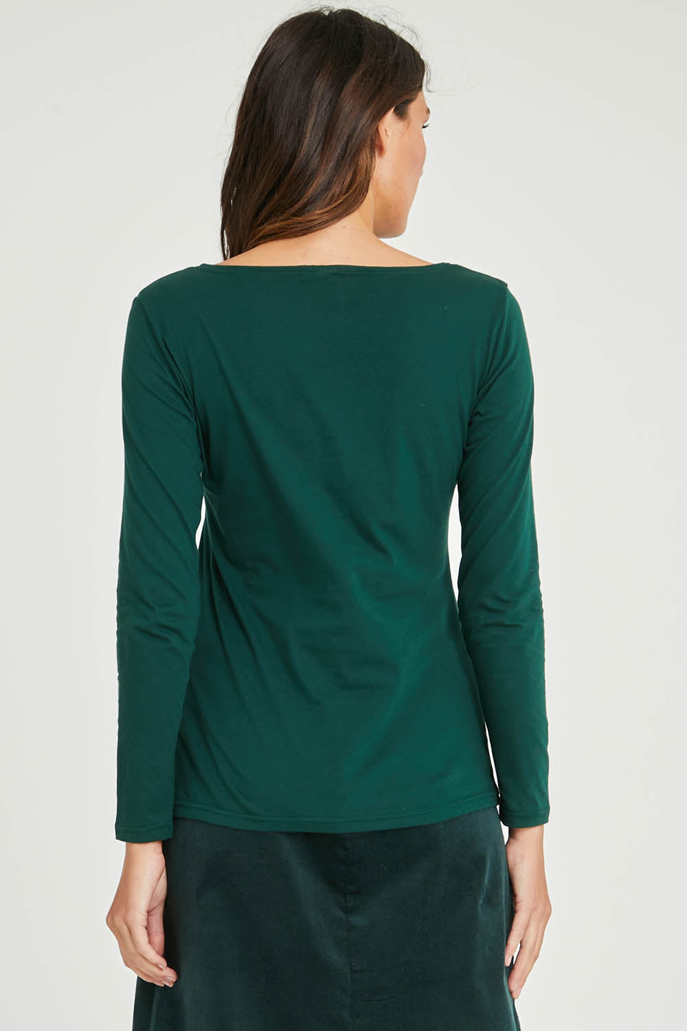 Model Madeline wearing size S of the Hanna Placement Tee in colour Forest (Green), from the back
