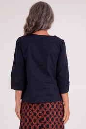 Model Luisa wearing size S of the Lori Top in colour Navy (Blue), from the back