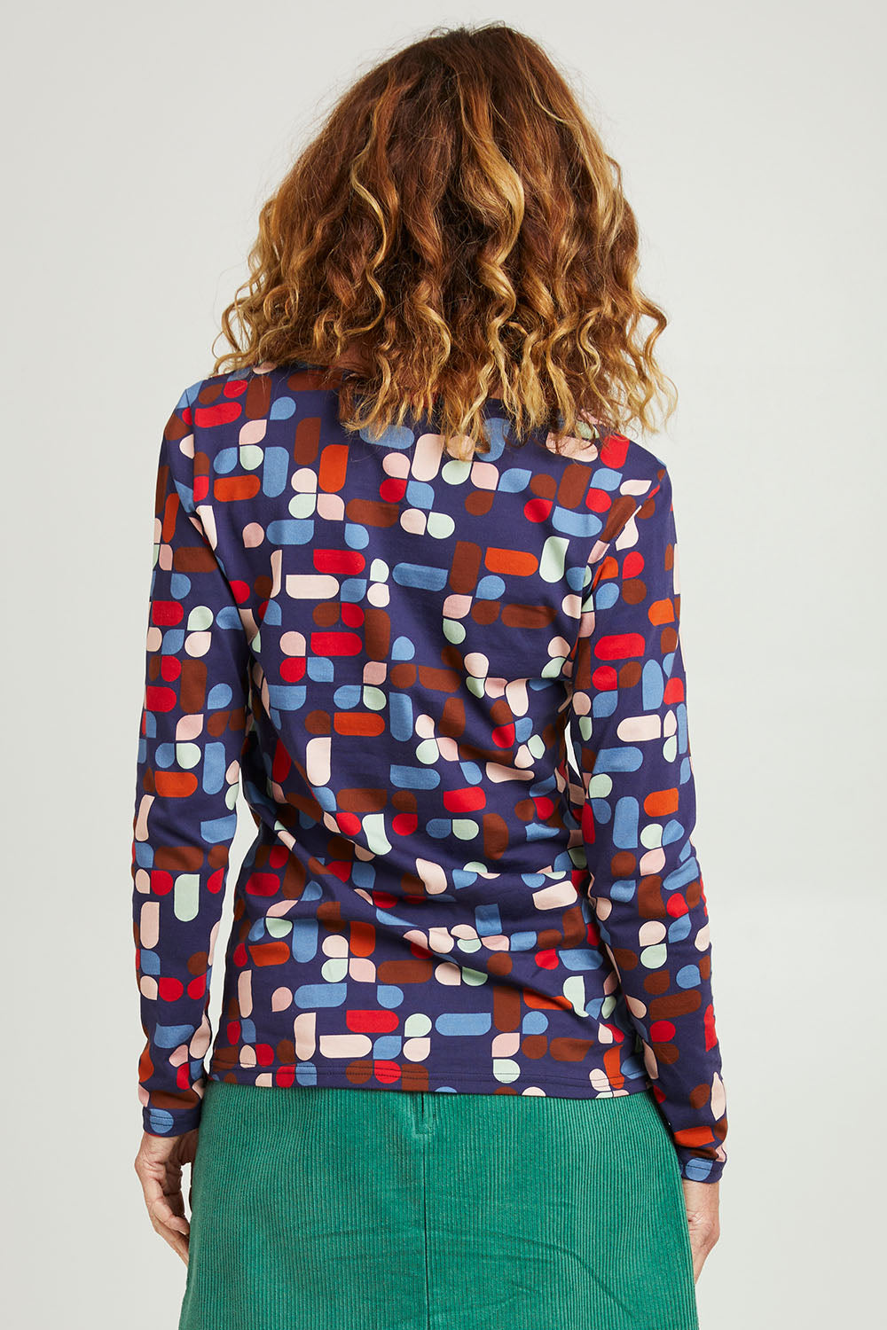 Model Emma wearing size S of the Abstract Boat Neck Tee in colour Blue (Blue), from the back