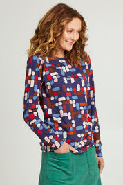 Model Emma wearing size S of the Abstract Boat Neck Tee in colour Blue (Blue), from the front, cropped image