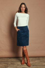 Model Madeline wearing size S of the Amy Cord Skirt in colour Teal (Blue), from the front, showing the whole outfit
