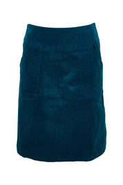 Product shot of the Amy Cord Skirt in colour Teal (Blue), from the front