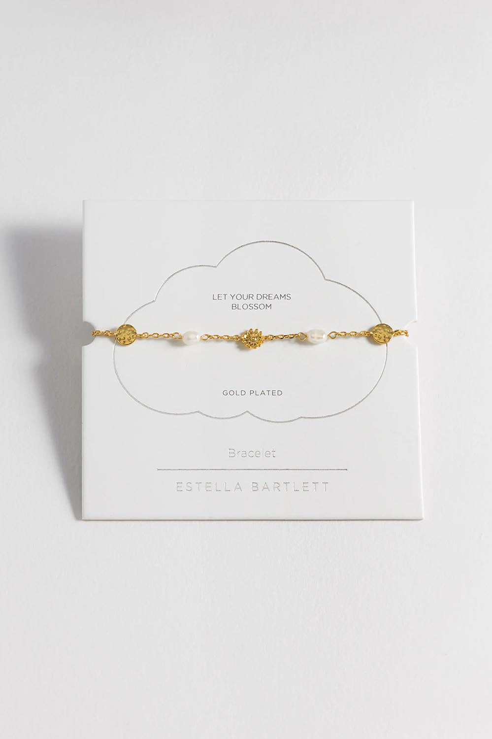 A model wearing the Flower Pearl Hammered Disc Bracelet in colour Goldpearl (Metallics), from the front, showing the whole outfit
