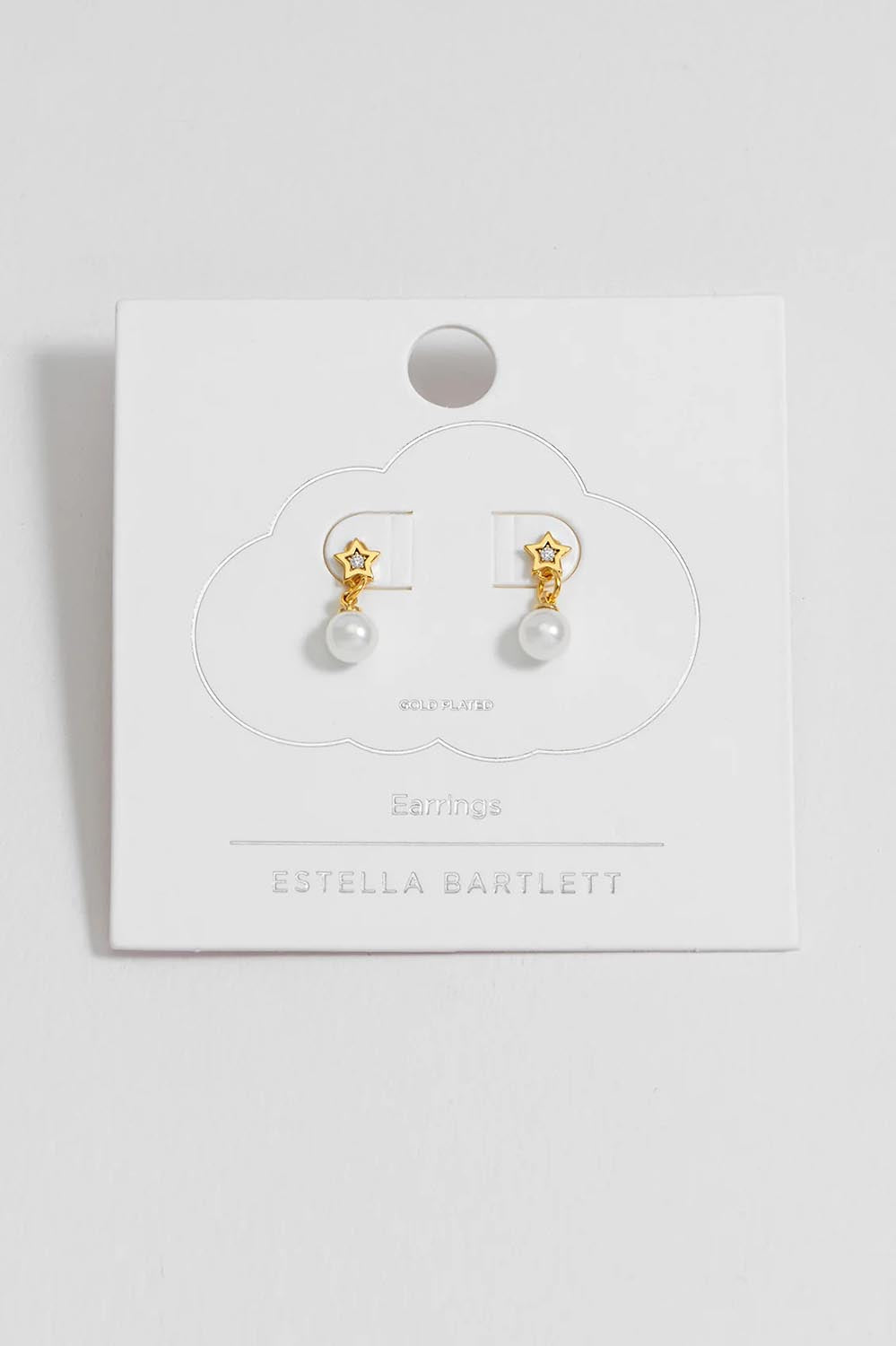 A model wearing the Star & Pearl Stud Earring in colour Goldpearl (Metallics), from the front, showing the whole outfit