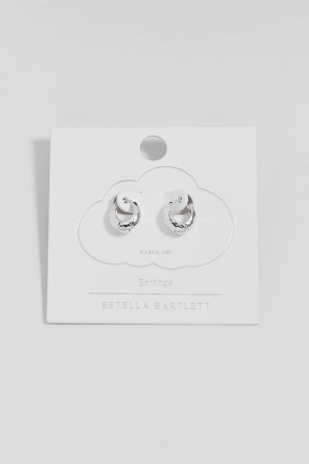 Product shot of the Hammered Huggie Hoops – Silver in colour Silver, from the front
