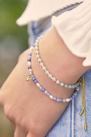 A model wearing the Amelia Amazonite Bracelet in colour Amazonite (Green), from the front, cropped image