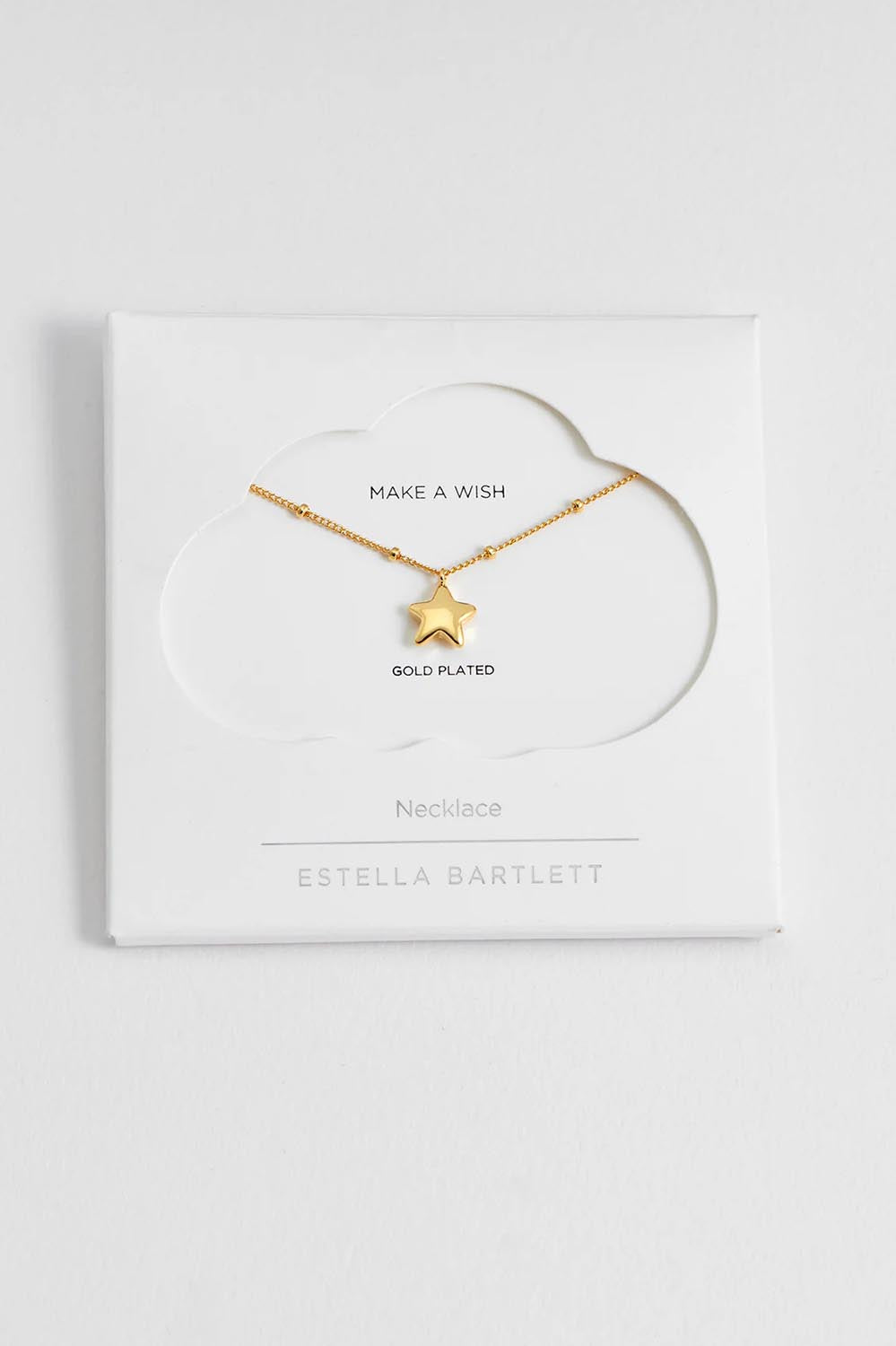 A model wearing the Hand Drawn Star Pendant On Beaded Chain in colour Gold (Metallics), from the front, showing the whole outfit