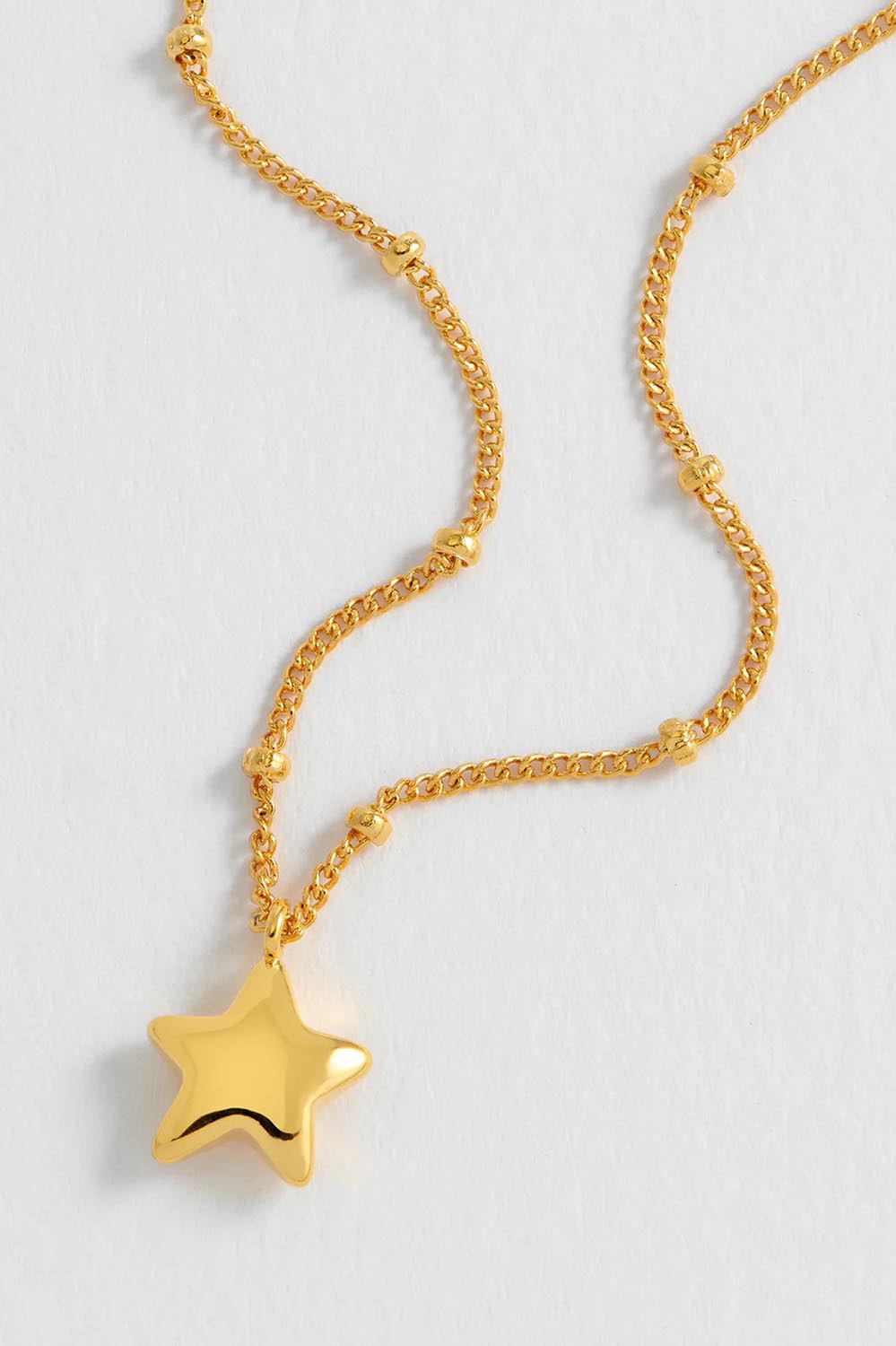Product shot of the Hand Drawn Star Pendant On Beaded Chain in colour Gold (Metallics), detail