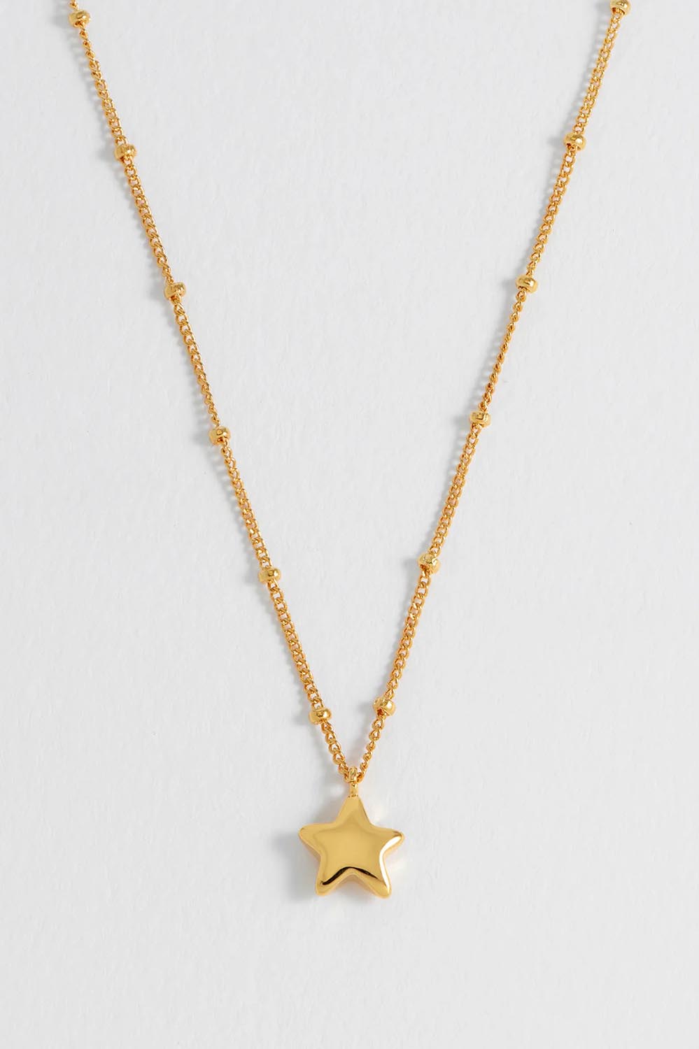 Product shot of the Hand Drawn Star Pendant On Beaded Chain in colour Gold (Metallics), detail