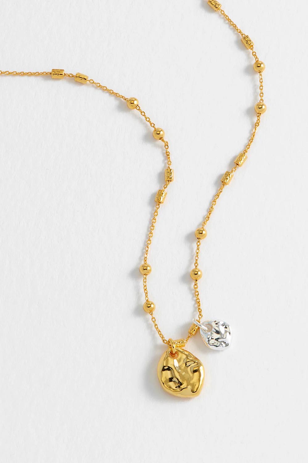 Product shot of the Beaded Chain & Molton Pebbles Necklace in colour Goldsilver (Metallics), detail