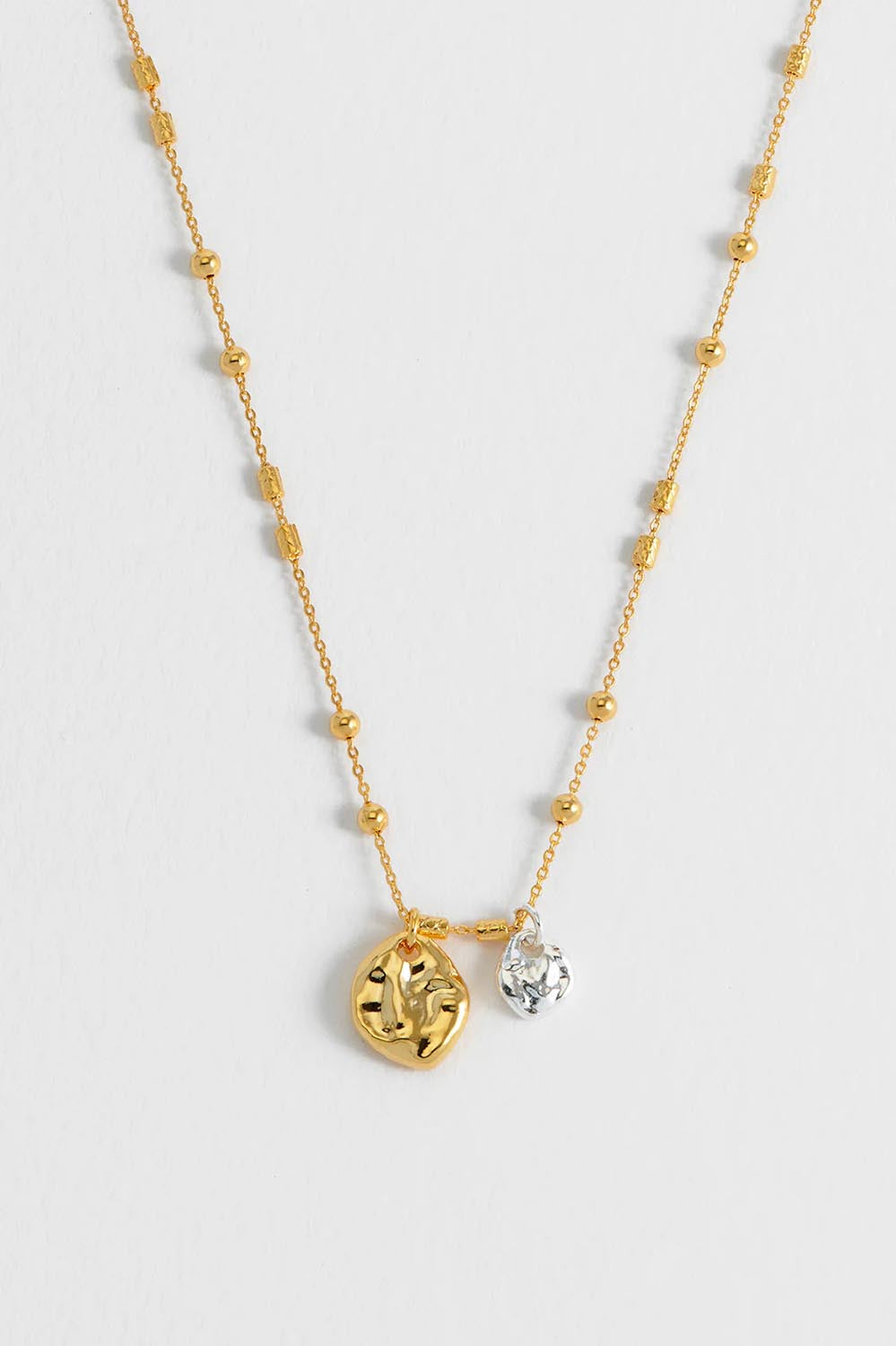 Product shot of the Beaded Chain & Molton Pebbles Necklace in colour Goldsilver (Metallics), detail