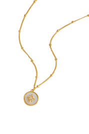 Product shot of the North Star Coin Necklace – Gold in colour Gold, showing detail