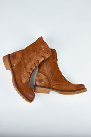 A model wearing size 37 of the Military Lace Up Boot in colour Cognac, from the front, showing the whole outfit