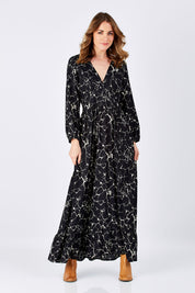 Model Helen wearing size S of the Luna Dress in colour MarbleBlac (Black), from the front, showing the whole outfit