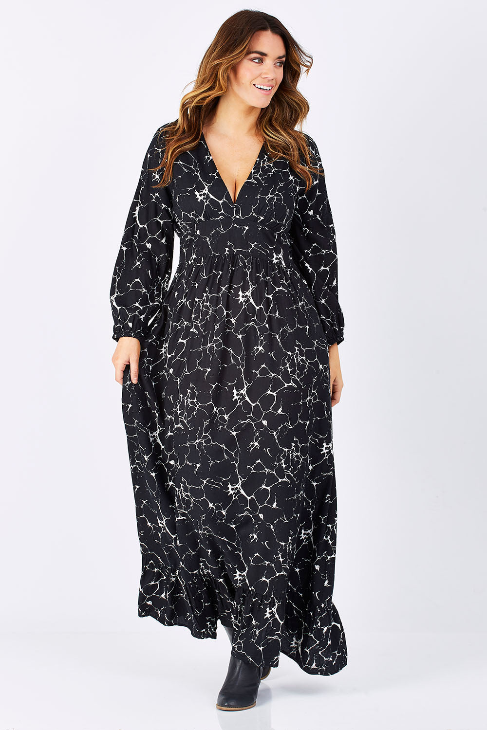 Model Laura wearing size M of the Luna Dress in colour MarbleBlac (Black), from the front, showing the whole outfit