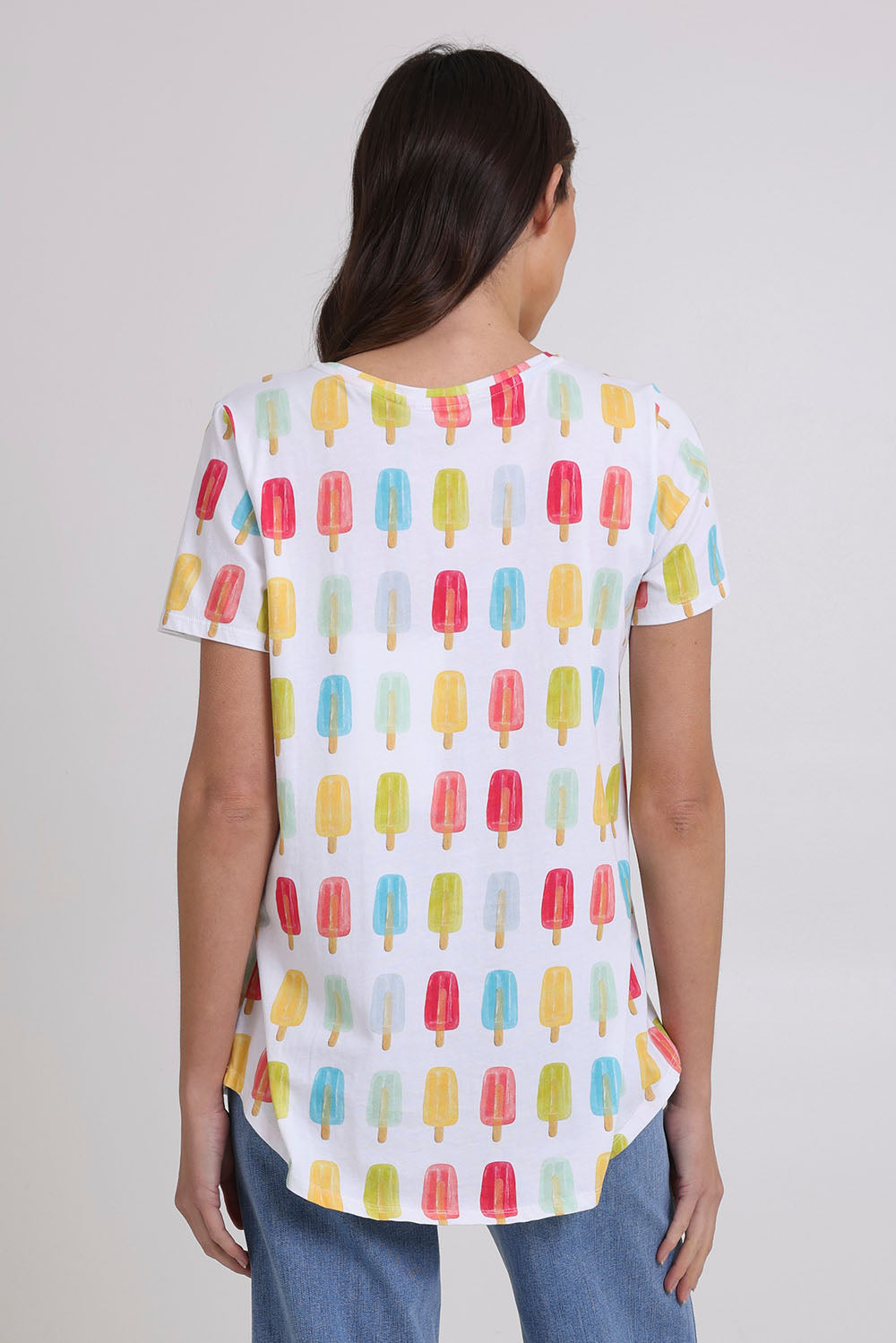 Model Madeline wearing size S of the Here Comes The Summer Cotton Tee in colour Icy, from the back