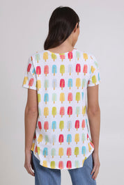 Model Madeline wearing size S of the Here Comes The Summer Cotton Tee in colour Icy, from the back