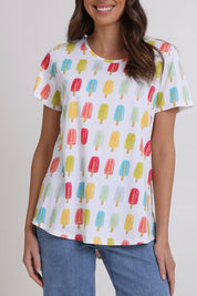 Model Madeline wearing size S of the Here Comes The Summer Cotton Tee in colour Icy, from the front, cropped image
