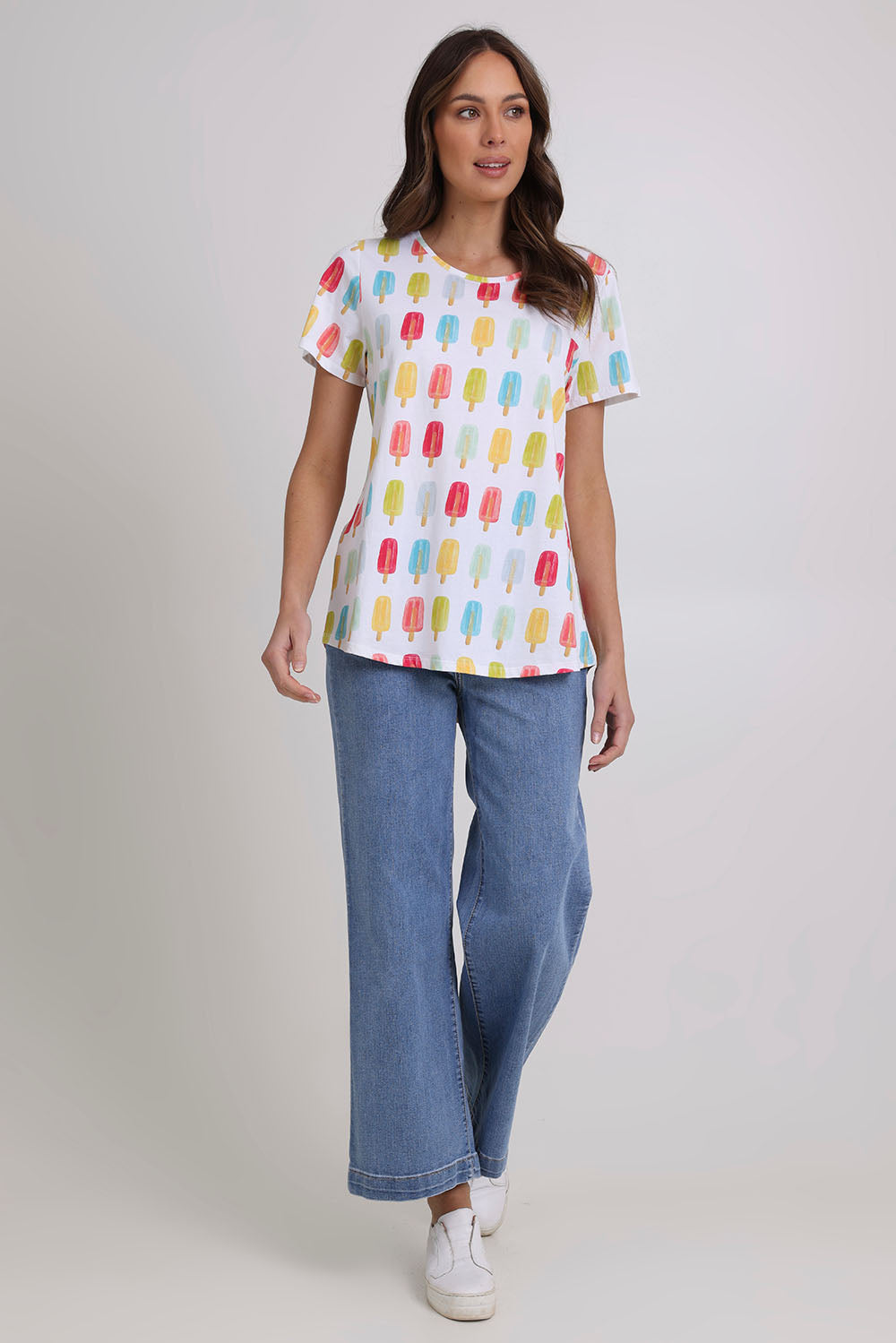 Model Madeline wearing size S of the Here Comes The Summer Cotton Tee in colour Icy, from the front, showing the whole outfit