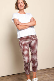 Model Riinar wearing size 10 of the Fuss Free Cotton Blend Taper Capri Trapeze Pant – Checkit in colour Checkit, from the front