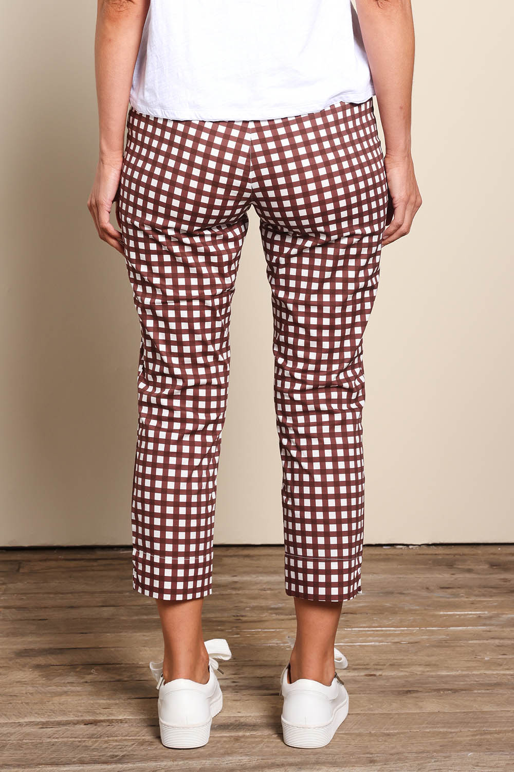 Model Riinar wearing size 10 of the Fuss Free Cotton Blend Taper Capri Trapeze Pant – Checkit in colour Checkit, from the front