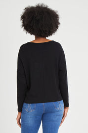 Model Aiyana wearing size S of the Patch Of The Day Top in colour Black (Black), from the back