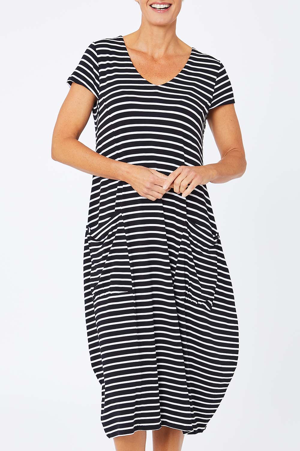 Model Amelia wearing size S of the Pocket Rocket Dress in colour Navwhistri (Blue), from the front, cropped image