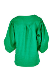 Product shot of the Blow Me Away Linen Top in colour Jade (Green), from the back