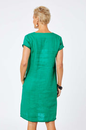 Model Amelia wearing size 10 of the Fringe Benefits Linen Dress in colour Jade (Green), from the back