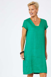 Model Amelia wearing size 10 of the Fringe Benefits Linen Dress in colour Jade (Green), from the front, cropped image
