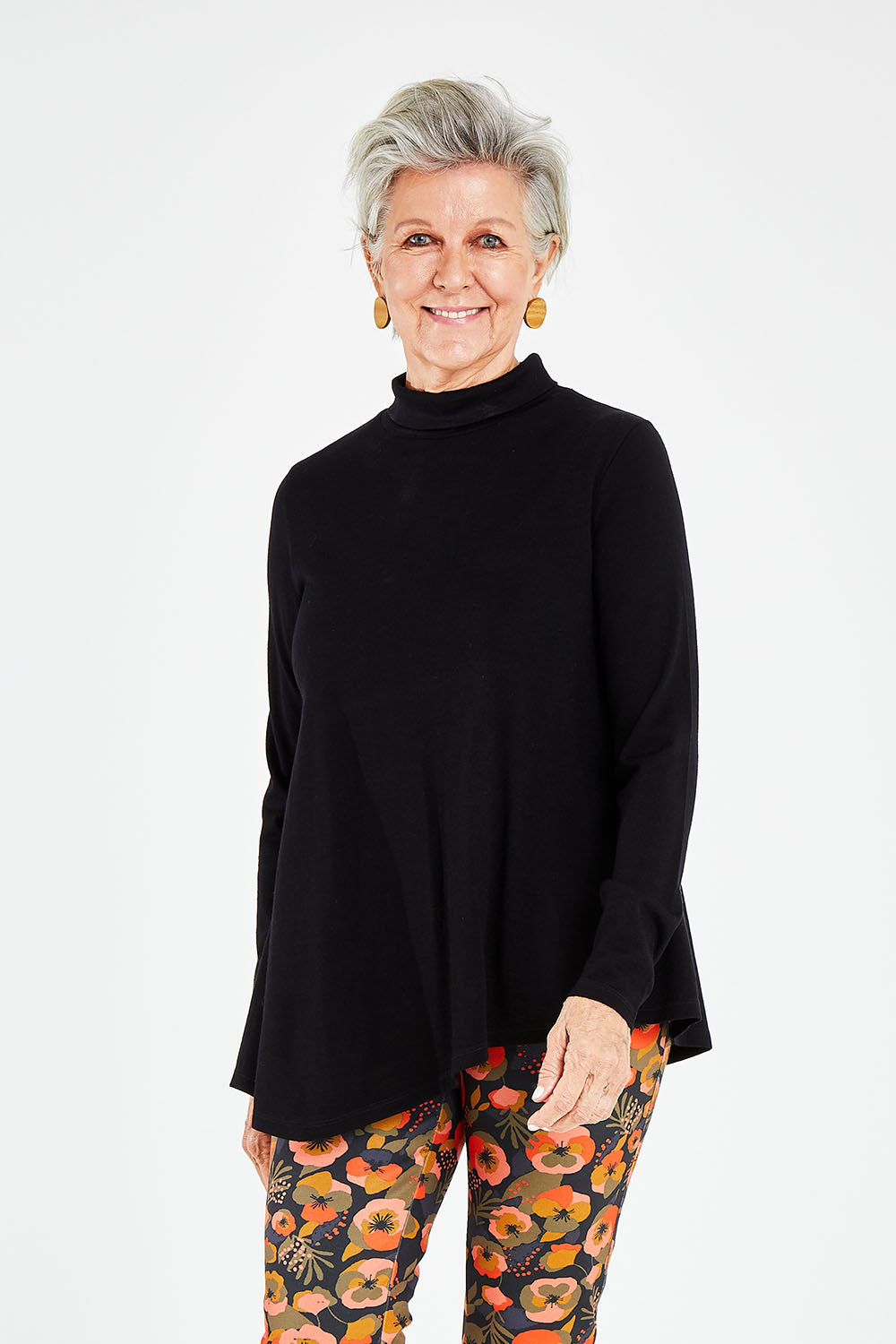 Model Elise wearing size S of the Licence To Swing Merino Jumper in colour Black (Black), from the front, cropped image