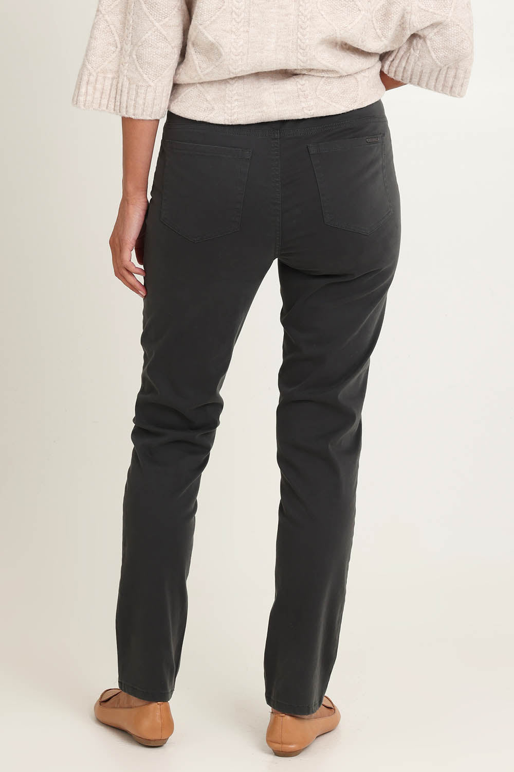 Model Riina wearing size 10 of the Holey Moleskin Trouser in colour Darksage (Green), from the back
