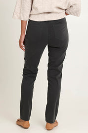 Model Riina wearing size 10 of the Holey Moleskin Trouser in colour Darksage (Green), from the back