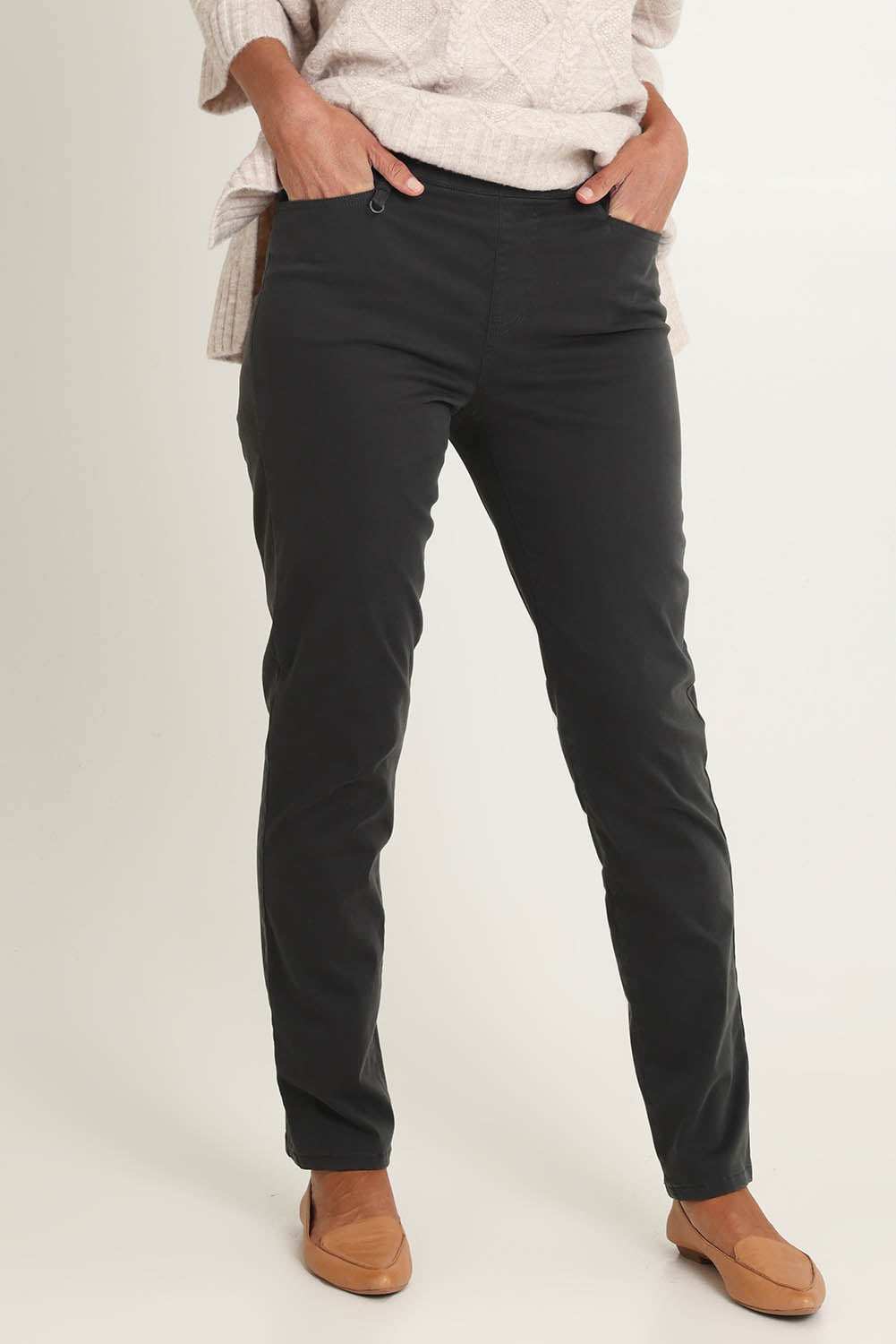 Model Riina wearing size 10 of the Holey Moleskin Trouser in colour Darksage (Green), from the front, cropped image