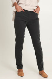 Model Riina wearing size 10 of the Holey Moleskin Trouser in colour Darksage (Green), from the front, cropped image