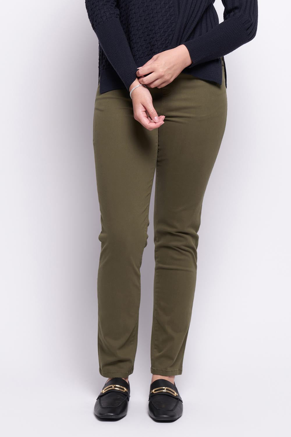 A model wearing the Holey Moleskin Trouser in colour Hunter (Green), from the front, cropped image