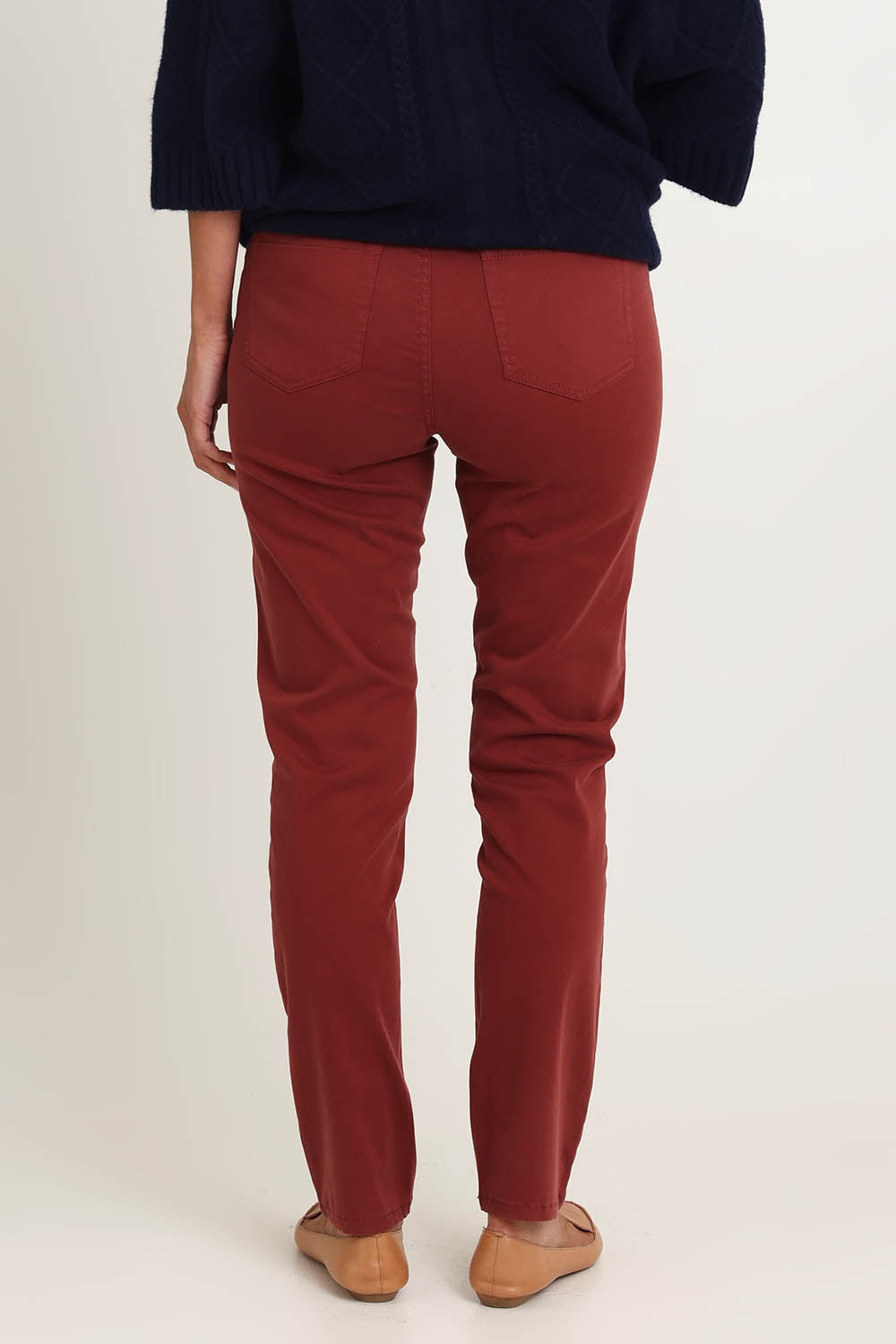 Model Riina wearing size 10 of the Holey Moleskin Trouser in colour Russet, from the back