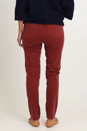 Model Riina wearing size 10 of the Holey Moleskin Trouser in colour Russet, from the back