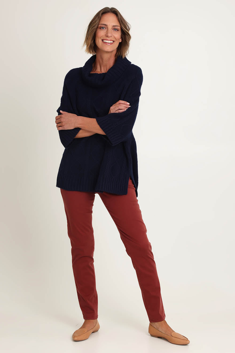 Model Riina wearing size 10 of the Holey Moleskin Trouser in colour Russet, from the front, showing the whole outfit
