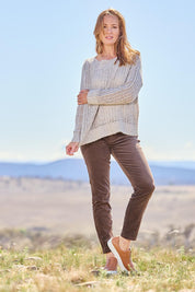 Model Katie wearing size 10 of the Of Your Own Accord Jean in colour Chocolate, from the front, showing the whole outfit