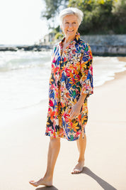 Model Elise wearing size 10 of the Natural Abilities Linen Dress in colour Chelsea (Blue), from the front, showing the whole outfit