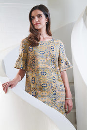A model wearing the Truly Frilling Linen Dress in colour Ornate, from the front, showing the whole outfit