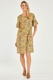 Model Kelly wearing size 10 of the Truly Frilling Linen Dress in colour Ornate, from the front, showing the whole outfit