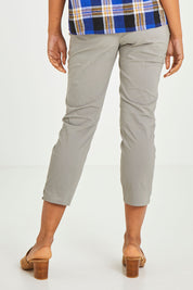 Model Olivia wearing size 10 of the Signature 7/8 Taper Trapeze Pant in colour Stone, from the back