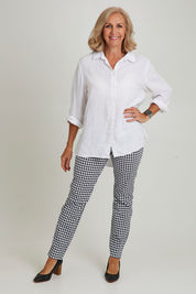 Model Sandy wearing size 10 of the Long Slim Trapeze Pant in colour Hound (Black), from the front, showing the whole outfit