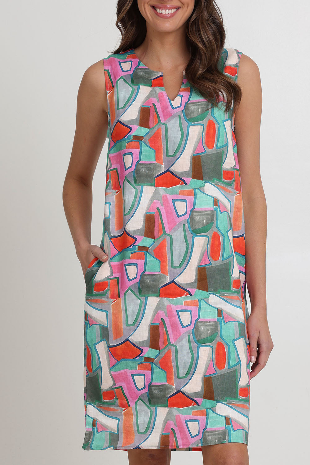 Model Madeline wearing size 10 of the Sunin colourSational Linen Dress - Fusion, from the front, cropped image