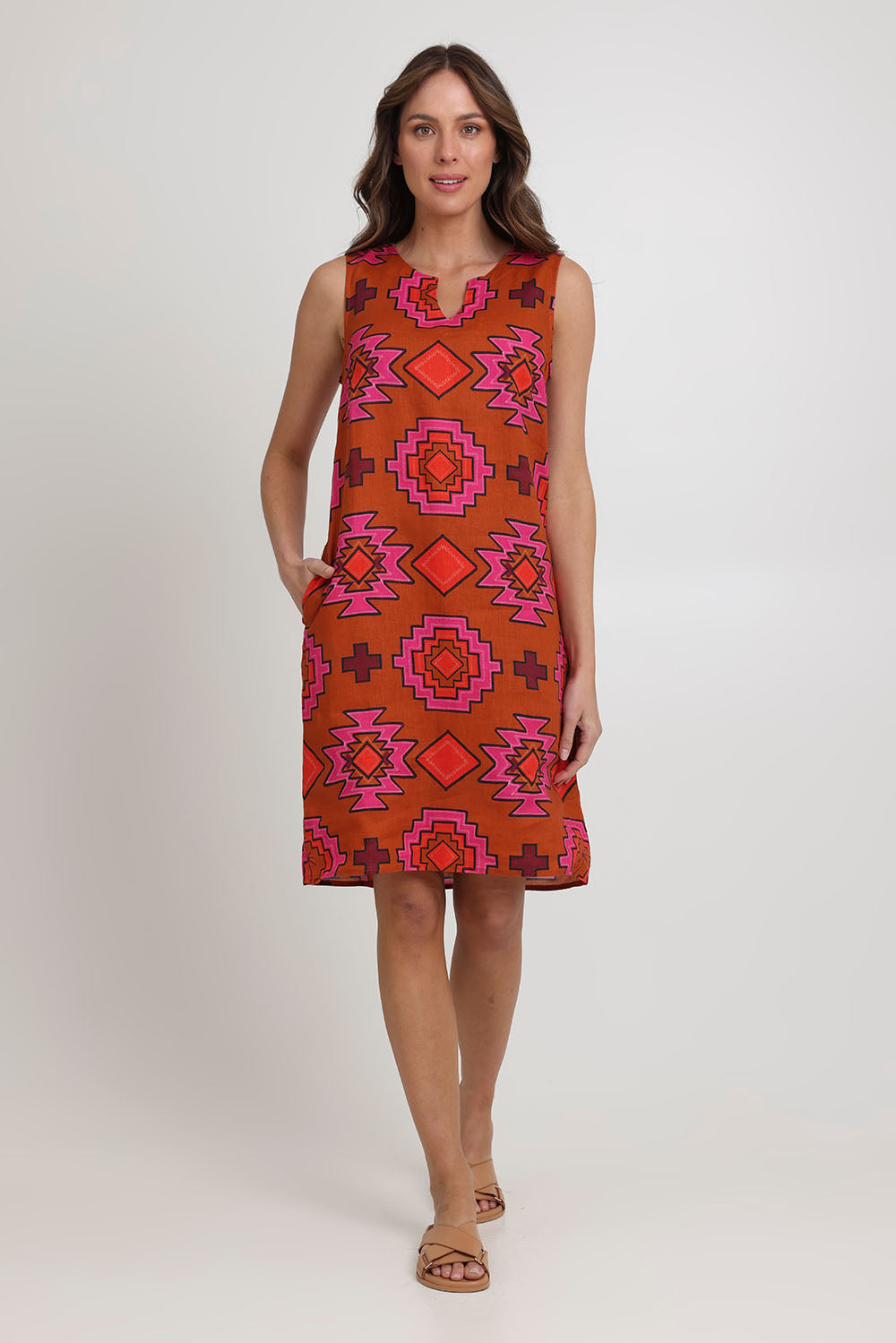 Model Madeline wearing size 10 of the Sunin colourSational Linen Dress - Palmcove, from the front, showing the whole outfit