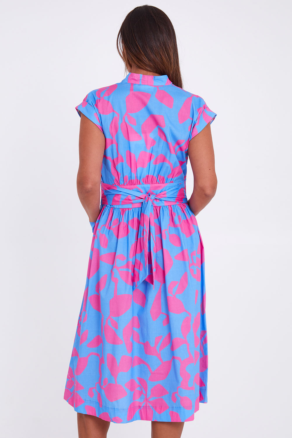 Model Alex wearing size 10 of the Its A Stunner Dress in colour Duo (Blue), from the back