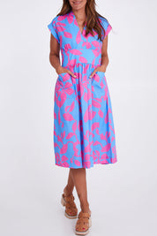 Model Alex wearing size 10 of the Its A Stunner Dress in colour Duo (Blue), from the front, cropped image