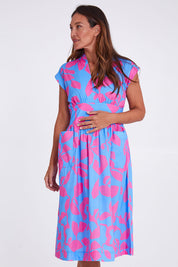 Model Alex wearing size 10 of the Its A Stunner Dress in colour Duo (Blue), from the front, cropped image